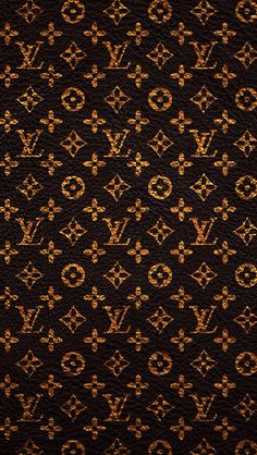 an old louis vuitton wallpaper with gold and black designs on it's surface