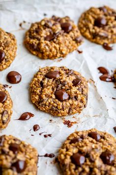 cookies with chocolate chips on parchment paper