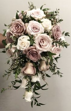 a bridal bouquet with pink and white flowers