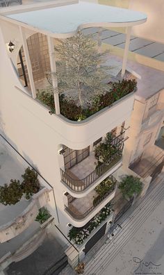 an aerial view of a building with plants growing on the balconies