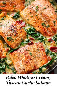 baked salmon and spinach in a skillet with text overlay that reads pale whole 30 creamy italian garlic salmon