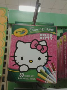 the hello kitty coloring pages are on display for kids to use in their school library