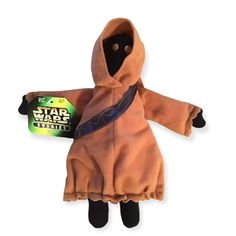 a stuffed animal in a star wars outfit with a tag on it's chest