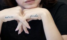 a woman with two fingers that have writing on their palms and the words grandma written on her hands