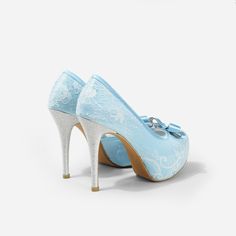 Lady Bella is a pair of custom made shoes in sweet baby blue satin. This pair of wedding heels features silky satin fabric with ivory white lace overlay. The front of this bridal heel features a dainty bow and the 4.5 inch heel of this bridal shoe is finished in silver glitter fabric. This pair of shoes is made using satin, glitter, lace, PU and other synthetic materials. They can be customized in different heel heights, colors and styles. They come with 0.5 inch elevated platform front. CUSTOMI Satin Closed-toe Wedding Shoes, Satin Closed Toe Wedding Shoes, Closed Toe Satin Heels For Wedding, Satin Closed Toe Heels For Wedding, High Heel Satin Wedding Shoes, Satin High Heel Wedding Shoes, Light Blue Round Toe Evening Wedding Shoes, Elegant Light Blue Wedding Shoes For Formal Occasion, Light Blue High Heel Wedding Heels