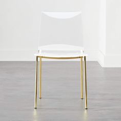 a white chair with gold legs and a clear seat cover on it's back