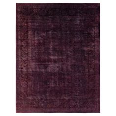 a purple rug with an intricate design on the top and bottom, it is made out of