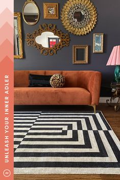 a living room filled with furniture and pictures on the wall next to a rug covered in black and white stripes