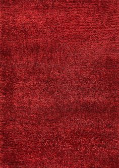 a red area rug with an uneven design