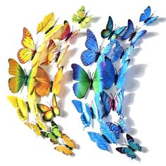 several colorful butterflies flying in the air