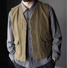 A hardworking gilet. Make yours lined or unlined, with facings on the inside or outside. Classic Cotton Sweater Vest For Work, Fitted Utility Vest For Workwear, Military Style Winter Workwear Vest, Winter Military Work Vest, Military Style Sleeveless Cotton Vest, Winter Workwear Vest With Welt Pockets, Khaki Winter Work Vest, Classic Outdoor Vest, Khaki Winter Workwear Vest