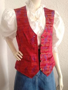 2000 red vest, musical notes print vest, jacquard funny vest, spring red vest, tailored gilet, two pockets, disco vest, pop-art vest.  vintage items always show signs of being worn  please check the measurements before ordering  measurements laying flat : shoulders :34 cm (13 inches)  bust :44cm (17,5 inches)  waist :41 cm (16 inches)  total lenght :57cm (22,5 inches) Red Vest With Pockets For Spring, Red Vest With Pockets, Red Sleeveless Vest With Pockets, Retro Red Sleeveless Vest, Red Sleeveless Retro Vest, Retro Red Cotton Vest, Red Retro Cotton Vest, Red Cotton Retro Vest, Red Fitted Vest For Spring