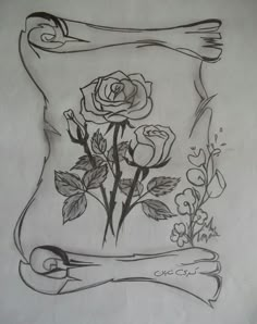 a drawing of some roses on a piece of paper with a scroll around the edges