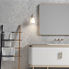 a bathroom with a sink, mirror and towel rack on the wall next to it