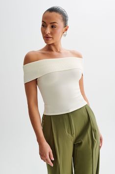 Bare necessity.Indulge in understated elegance with the SUSANNA Off Shoulder Knit Top. This exquisite piece features an off-the-shoulder design that highlights your décolletage with effortless allure. The overlay gracefully drapes over the arms, adding a touch of sophistication to your look. Crafted from ribbed fabrication, this top offers a luxurious texture and a bodycon fit that accentuates your curves with grace. Unlined for lightweight wear, it ensures comfort without compromising on style. Perfect for both casual and dressed-up occasions, the Susanna Off Shoulder Knit Top is a versatile addition to your wardrobe that exudes timeless charm. Off Shoulder Knit Top, Maxi Dress Sale, Black Tie Wedding, Beige Dresses, Understated Elegance, Swimwear Sale, Crepe Dress, Shoulder Design, Denim Coat