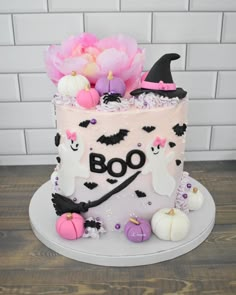 a decorated cake with halloween decorations on it