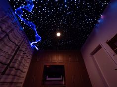 the ceiling is decorated with stars and blue lights