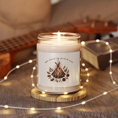 Bring the warmth and nostalgia of a crackling campfire into your home with our Campfire Nights Candle! 🕯️🔥 Featuring a rustic, nature-inspired design of a cozy bonfire scene, this candle will transport you to those cherished moments of gathering 'round the fire, toasting marshmallows, and sharing stories under the starry sky. .: Christmas Warmth Scent .: Materials: 100% natural soy wax blend, 100% cotton wick and a glass jar .: One size: 2.8″ × 3.5" (7.1cm × 8.9cm) .: Compliant with ASTM safety standards .: Burning time: 50-60 hours .: Glossy permanent adhesive label .: Choose from nine different aromatic scents .: Assembled in the USA from globally sourced parts .: Please note: All scents have the same wax color Created with the help of AI. Candle Fireplace, Fireplace Candle, Candle Cozy, Toasting Marshmallows, Fall Candle Scents, Candles In Fireplace, Candle Night, Cozy Candles, Home Decor Wood