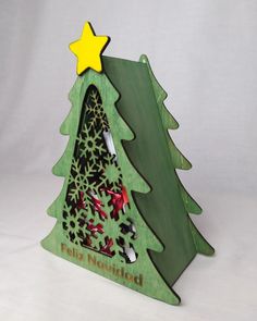 a wooden christmas tree with a star on top