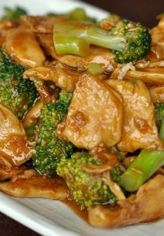 broccoli and chicken stir fry on a white plate