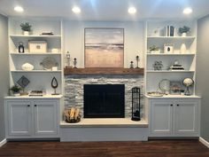 a living room filled with furniture and a fire place under a painting on the wall