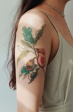 a woman with a flower tattoo on her arm