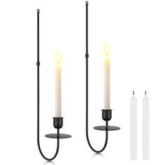 two candle holders with one light on each side