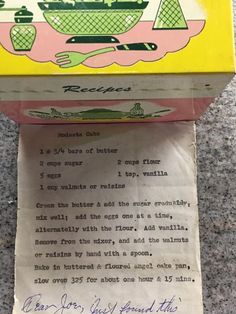 an old recipe box with writing on it and a handwritten letter to the cook