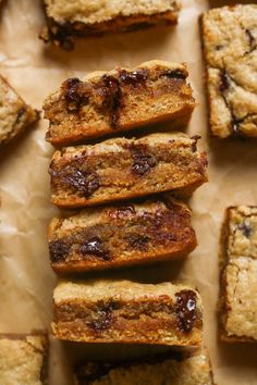 several pieces of cake sitting on top of a piece of parchment paper