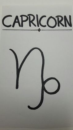 the capricorn symbol is drawn on a piece of paper