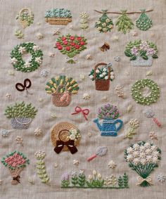 a close up of a piece of cloth with flowers and potted plants on it