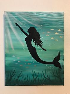 a painting of a mermaid swimming in the ocean with her arms outstretched and feet up