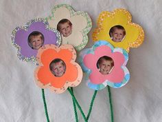 there are four flowers that have been made to look like children's faces