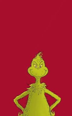 dr seuss from the grin movie standing in front of a red background with his hands on his hips