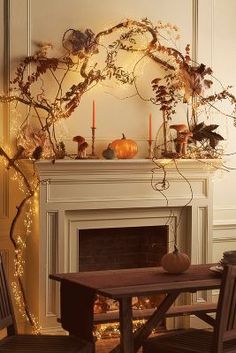 a living room filled with furniture and a fire place next to a fireplace covered in candles