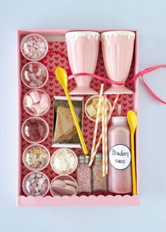 a pink box filled with lots of different items