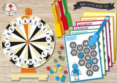 an image of a game set up on a table with markers, pens and scissors