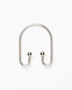 a pair of metal hooks on a white background