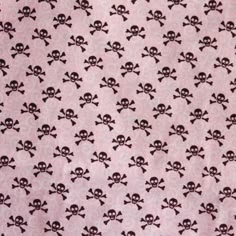 a pink background with black skulls and crossbones