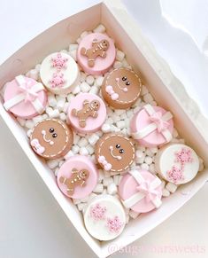 a box filled with lots of decorated cookies