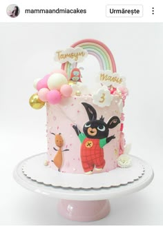 a birthday cake decorated with an image of a bunny holding a balloon and number 3