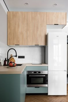 a kitchen with wooden cabinets and white appliances