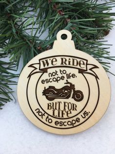 a wooden ornament that says we ride not to escape, but for life not to escape