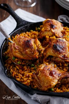 chicken and rice in a skillet on a table