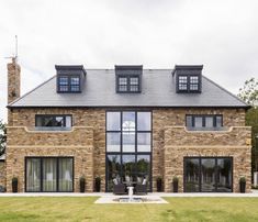 a large brick house with lots of windows