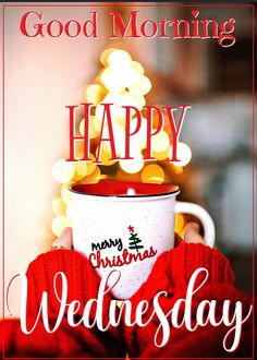 a person holding a coffee cup with the words good morning happy wednesday on it in front of a christmas tree