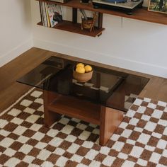 a glass table with some fruit on it