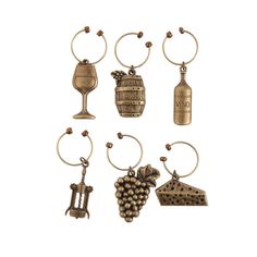 six wine charms are shown in different styles