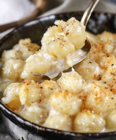 a close up of a spoon with food in it