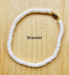 "White puka shell necklace with silver plated screw clasp or lobster clasp in 4 sizes to choose from 14\", 16\", 18\", 20\" . Bright white rounded polished puka beads that measure approximately 1/4\". Now available white puka bracelet (7\") and anklet (10\"). Great addition to your jewelry collection, great gift idea or use it in crafts. Puka shells are gifted to wish good luck to the receiver." Poka Shell Necklace, Adjustable White Shell For Beach, White Adjustable Shell For Beach, Adjustable White Shell Necklace Coastal Style, Adjustable White Shell Necklace In Coastal Style, White Strand Jewelry Gift, White Strand Jewelry As Gift, Adjustable White Shell Necklace For Beach Season, Adjustable White Jewelry For The Beach